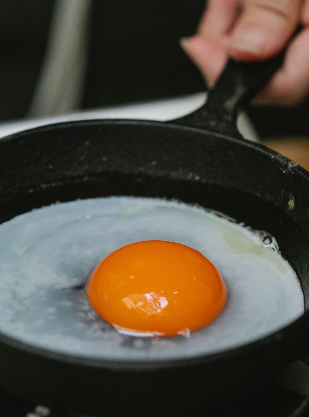 Egg frying in a small skillet