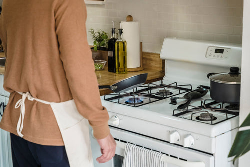 Holding a pan in the kitchen